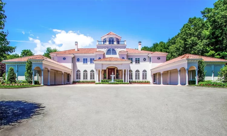 Mediterranean / spanish-style home with a garage