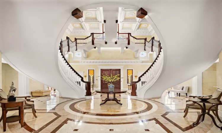 Foyer entrance with a towering ceiling