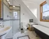 Full bathroom with tile patterned flooring, toilet, sink, and independent shower and bath