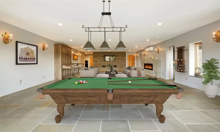 Playroom featuring billiards and a wall mounted AC