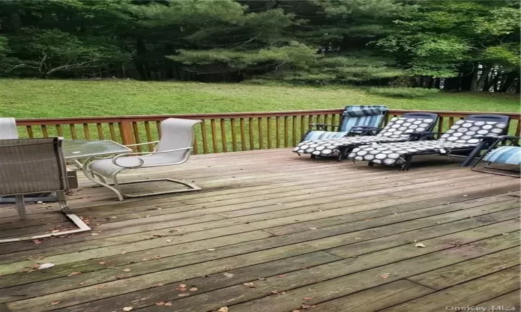 Wooden terrace with a yard