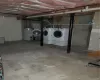 Basement featuring washer and dryer and water heater