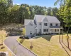 View of front of house with a porch and a front lawn