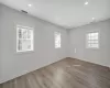 Spare room with hardwood / wood-style floors