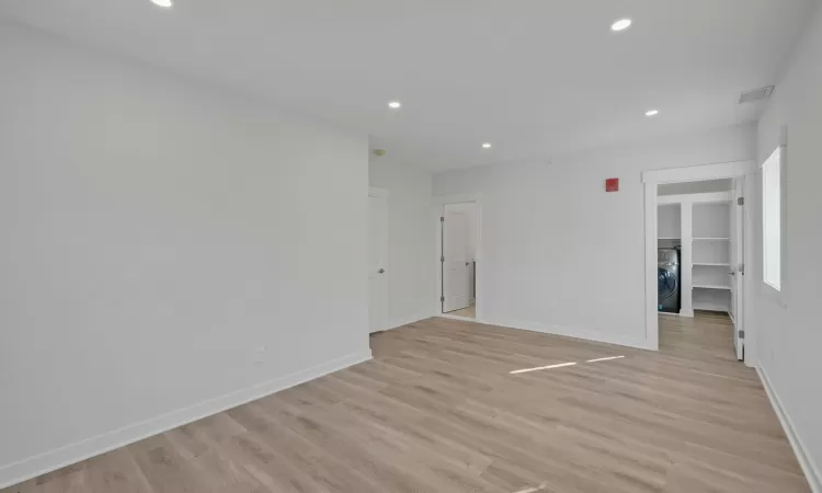 Unfurnished room featuring light wood-type flooring