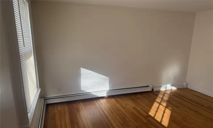 Empty room featuring hardwood / wood-style floors