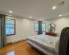 Bedroom featuring light hardwood / wood-style floors and baseboard heating