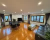 Living room with light wood-type flooring and a baseboard radiator