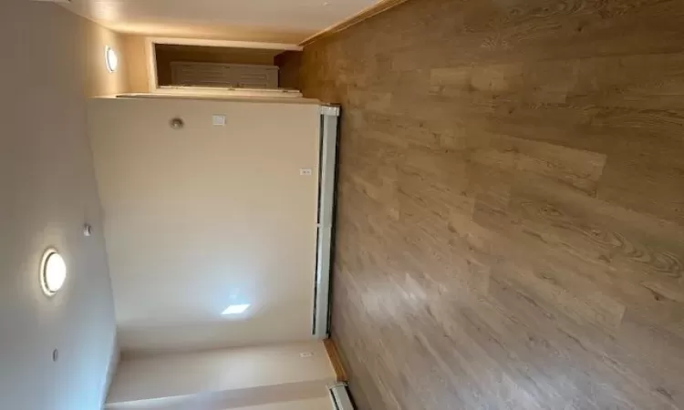 Unfurnished room with wood-type flooring