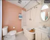 Bathroom featuring tile patterned floors, vanity, and toilet