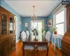 Dining space featuring a chandelier and hardwood / wood-style flooring