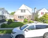 View of front of house with a front lawn