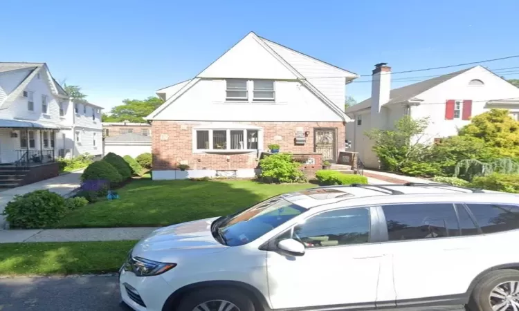 View of front of house with a front lawn