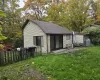 Rear view of house featuring a yard