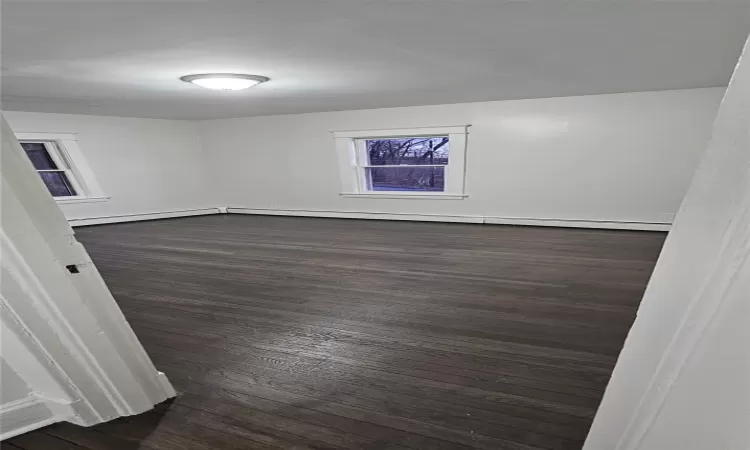 Bedroom featuring dark wood-type flooring