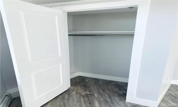 Closet featuring a baseboard heating unit