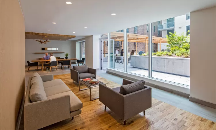 Living room with light hardwood / wood-style flooring