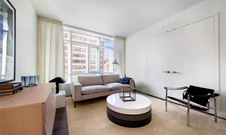 Living area with hardwood / wood-style floors