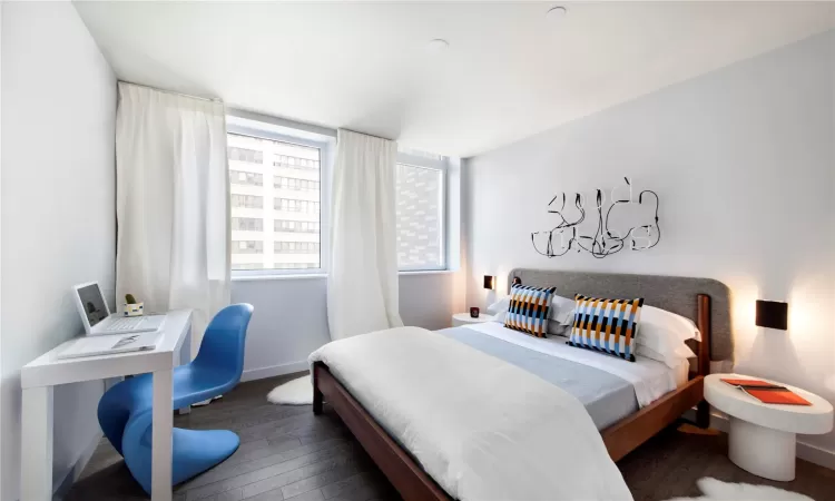 Bedroom featuring dark hardwood / wood-style flooring