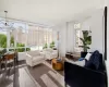 Sunroom featuring a chandelier