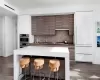 Kitchen with a kitchen breakfast bar, sink, decorative backsplash, dark hardwood / wood-style floors, and appliances with stainless steel finishes