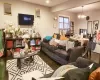 Living room with hardwood / wood-style floors and an inviting chandelier