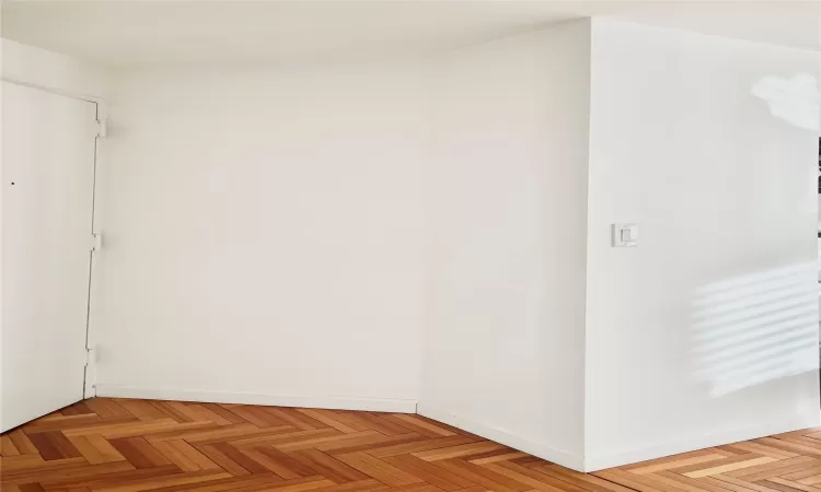 Spare room featuring light parquet flooring