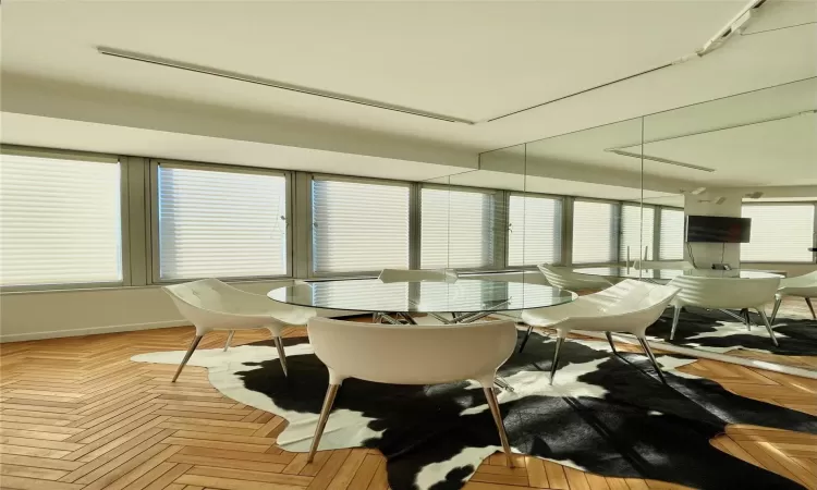 Dining room with light parquet floors