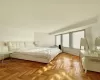 Bedroom featuring light parquet flooring