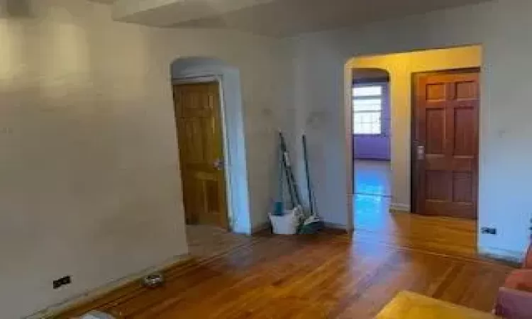 Unfurnished room featuring wood-type flooring