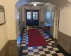 Foyer entrance with french doors and ornamental molding