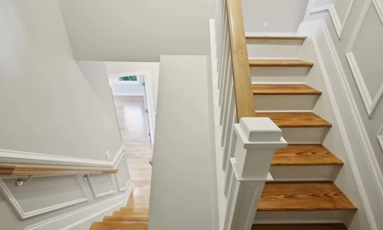 Additional living space with lofted ceiling and light wood-type flooring