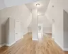 Virtually Staged 3rd floor bonus room featuring lofted ceiling and light wood-type flooring