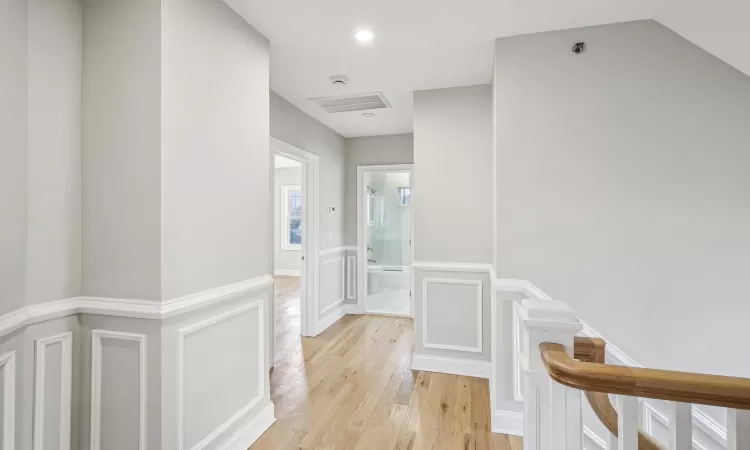 Primary bedroom featuring light hardwood / wood-style flooring