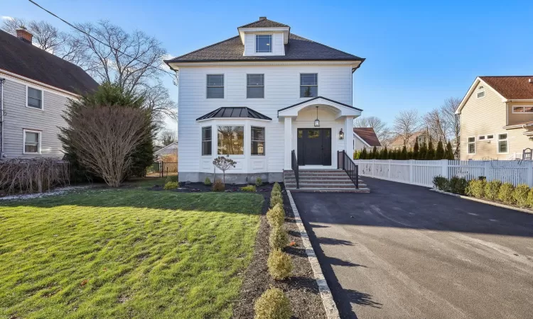 View of front of home with a front yard