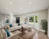 Virtually StagedLiving room with light wood-type flooring and crown molding