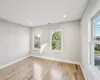 Full bathroom with combined bath / shower with glass door, vanity, and toilet