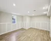 Virtually StagedRec room with pool table and light hardwood / wood-style flooring