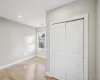 Unfurnished bedroom featuring two closets and light hardwood / wood-style floors