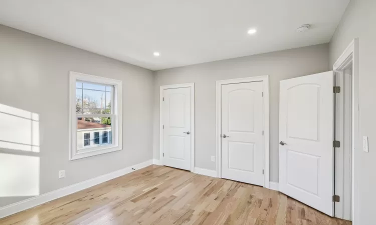 Spare room with light hardwood / wood-style floors