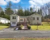 View of front of property featuring a front lawn