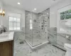 Bathroom featuring vanity, a baseboard radiator, an enclosed shower, and toilet