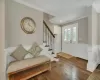 Foyer with hardwood / wood-style flooring and ornamental molding