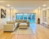 Living room featuring light hardwood / wood-style floors and crown molding