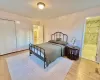 Bedroom featuring connected bathroom, a closet, and light hardwood / wood-style floors