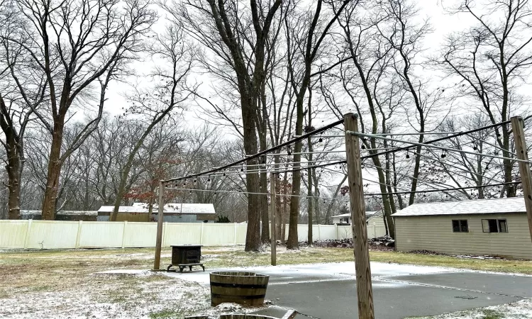 View of yard layered in snow