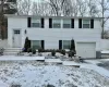 Bi-level home featuring a garage