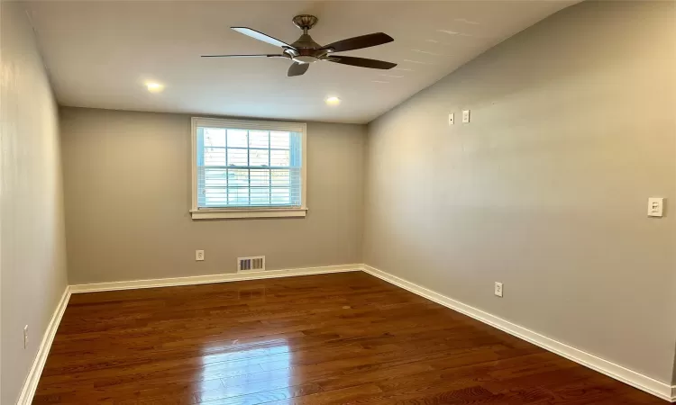 Primary bedroom with vaulted ceiling, and ceiling fan