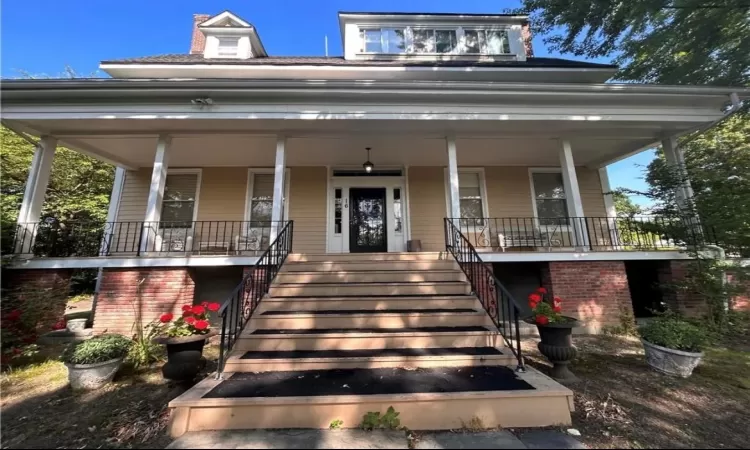 View of front facade featuring a porch