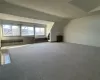 Bonus room with carpet and lofted ceiling